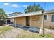 Backyard area with a covered patio, outdoor seating, and well-maintained landscaping at 3626 S Hesperides St, Tampa, FL 33629