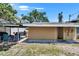 View of the home's backyard area with a covered patio and outdoor seating at 3626 S Hesperides St, Tampa, FL 33629
