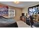 Bedroom featuring a simple aesthetic with a bed, desk, and a collection of wall decorations at 3626 S Hesperides St, Tampa, FL 33629