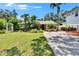 Lovely home boasting a well-kept lawn, mature trees, and ample parking space in the long driveway at 3626 S Hesperides St, Tampa, FL 33629