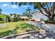 Inviting home with a lush, green front yard and a long driveway leading to the property at 3626 S Hesperides St, Tampa, FL 33629
