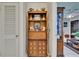 Charming hallway featuring a built-in wooden display cabinet with ornate details and ample storage at 3626 S Hesperides St, Tampa, FL 33629