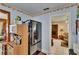 Open kitchen area next to a full sized stainless steel refrigerator at 3626 S Hesperides St, Tampa, FL 33629