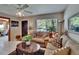 Comfortable living room featuring cozy sofas, stylish decor, and a ceiling fan for efficient cooling at 3626 S Hesperides St, Tampa, FL 33629