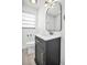 Nicely renovated bathroom featuring modern vanity with black fixtures and elegant mirror at 4000 Grove S St, St Petersburg, FL 33705