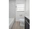 Well-lit bathroom with modern tiling, new fixtures, and sleek design elements at 4000 Grove S St, St Petersburg, FL 33705