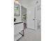 This bathroom features a white vanity and is next to the toilet in an adjoining room at 4000 Grove S St, St Petersburg, FL 33705