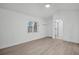 This is a simple bedroom with neutral walls and wood floors at 4000 Grove S St, St Petersburg, FL 33705