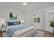 This virtually staged bedroom features neutral walls, wood floors and a ceiling fan at 4000 Grove S St, St Petersburg, FL 33705
