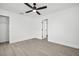 Clean bedroom featuring a ceiling fan, ample lighting, and a spacious closet at 4000 Grove S St, St Petersburg, FL 33705