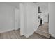 Hallway leading from bedroom towards the kitchen, showing the open closet space at 4000 Grove S St, St Petersburg, FL 33705