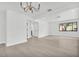 Expansive living area with hardwood floors, neutral walls, and multiple entry points at 4000 Grove S St, St Petersburg, FL 33705