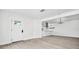 Bright, open-concept living space features modern flooring and seamless kitchen access at 4000 Grove S St, St Petersburg, FL 33705