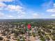 Aerial view of neighborhood location marked by a red map pin against houses, trees, and green space at 4120 Tyndale Dr, Brandon, FL 33511