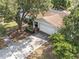 Aerial view of a home with mature trees and a driveway at 4120 Tyndale Dr, Brandon, FL 33511