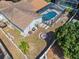 Aerial shot of the backyard showing the pool, firepit, and patio area, ideal for outdoor enjoyment at 4120 Tyndale Dr, Brandon, FL 33511