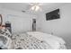 Bright bedroom with white walls, closet, ceiling fan, and TV at 4120 Tyndale Dr, Brandon, FL 33511
