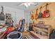 Bedroom with guitars hanging on the wall, office chair and musical keyboard at 4120 Tyndale Dr, Brandon, FL 33511
