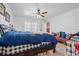 Comfortable bedroom with dresser, ceiling fan, and sliding glass door at 4120 Tyndale Dr, Brandon, FL 33511