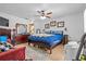 Comfortable bedroom with dresser, ceiling fan, and natural light at 4120 Tyndale Dr, Brandon, FL 33511