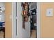 Organized closet with hats, belts and clothing hanging on the rod and shelf at 4120 Tyndale Dr, Brandon, FL 33511