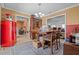Dining room featuring wooden furniture, rug, and vintage-style appliances at 4120 Tyndale Dr, Brandon, FL 33511