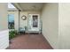 Welcoming front porch, bench, plantings, and decorative wreath at 4120 Tyndale Dr, Brandon, FL 33511