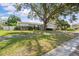 Charming single-story home featuring a two-car garage, mature landscaping, and a well-maintained lawn at 4120 Tyndale Dr, Brandon, FL 33511