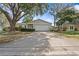 Charming single-story home featuring a two-car garage, mature landscaping, and a well-maintained lawn at 4120 Tyndale Dr, Brandon, FL 33511