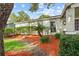 Charming home featuring a well-manicured lawn and colorful mulch landscaping at 4120 Tyndale Dr, Brandon, FL 33511