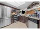 Kitchen featuring stainless steel appliances and dark wood cabinets at 4120 Tyndale Dr, Brandon, FL 33511