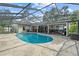 Backyard and in-ground pool with a screened enclosure and ample space for entertaining at 4120 Tyndale Dr, Brandon, FL 33511