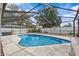 Screened-in pool area surrounded by a white fence, offering a private outdoor oasis at 4120 Tyndale Dr, Brandon, FL 33511