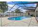 Backyard pool inside screened enclosure, near outdoor grilling area at 4120 Tyndale Dr, Brandon, FL 33511