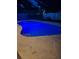 Inviting pool featuring cool blue lighting nestled into a serene outdoor living space at 4120 Tyndale Dr, Brandon, FL 33511