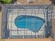 Overhead shot showcases the sparkling blue pool inside screened enclosure perfect for relaxation and entertainment at 4120 Tyndale Dr, Brandon, FL 33511