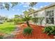 Well-maintained side yard featuring lush greenery and mulch landscaping at 4120 Tyndale Dr, Brandon, FL 33511