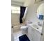 Bathroom features a bathtub with a shower, toilet, and sink at 4214 Foxboro Dr, New Port Richey, FL 34653
