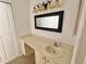 Bathroom vanity with mirror, cabinet storage, and sink at 4214 Foxboro Dr, New Port Richey, FL 34653