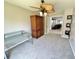 Bedroom featuring carpet, glass desk, wood wardrobe, and ceiling fan at 4214 Foxboro Dr, New Port Richey, FL 34653