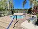 Secluded hot tub area with easy access and lush tropical landscaping at 4214 Foxboro Dr, New Port Richey, FL 34653