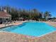 Beautiful community pool with a gazebo and plenty of lounge chairs for residents at 4214 Foxboro Dr, New Port Richey, FL 34653