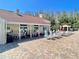 Resort-style pool deck with ample seating and a covered patio area at 4214 Foxboro Dr, New Port Richey, FL 34653