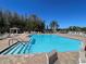 Inviting community pool featuring clear water and convenient access steps at 4214 Foxboro Dr, New Port Richey, FL 34653