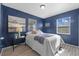 Stylish bedroom with navy walls, hardwood floors, and a modern aesthetic at 4226 4Th S Ave, St Petersburg, FL 33711