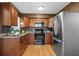 Kitchen features stainless steel appliances, wood cabinets and granite countertops at 4226 4Th S Ave, St Petersburg, FL 33711