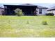 Spacious backyard featuring a covered patio, offering a perfect outdoor living space for relaxation at 4433 Eternal Prince Dr, Sun City Center, FL 33573