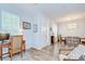 Bright entryway with hardwood floors and a view to dining and office areas at 445 Arch Ridge Loop, Seffner, FL 33584