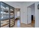 Hallway with a china cabinet leading to a bedroom at 445 Arch Ridge Loop, Seffner, FL 33584