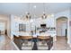Spacious kitchen with modern pendant lighting, quartz countertops, and stainless steel appliances at 445 Arch Ridge Loop, Seffner, FL 33584